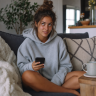 Gen Z girl texting, reacting to ts pmo meaning